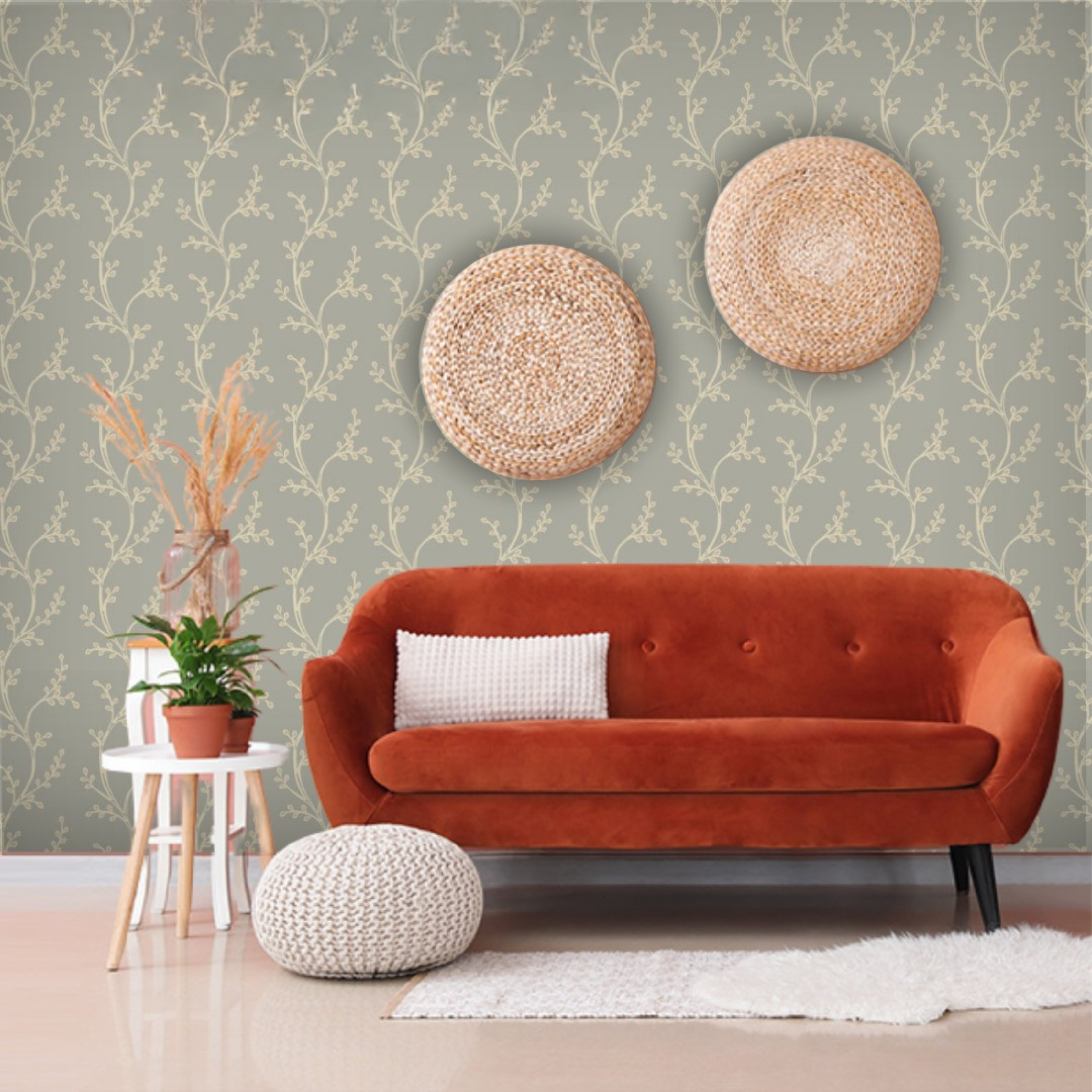 Orange sofa in a room with decorative wall art and plants.