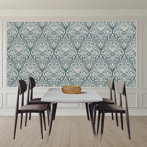 Dining room with a table and chairs against a decorative wall.