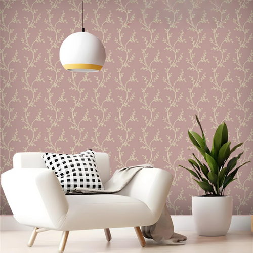 Modern living room with a white armchair, decorative pillows, and a plant against a pink floral wallpaper.