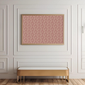 Patterned pink wall art on a white paneled wall with a gold bench below.