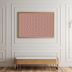 Patterned pink wall art on a white paneled wall with a gold bench below.