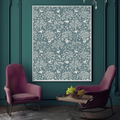 Two pink chairs in a room with a decorative wall art piece featuring white patterns on a teal wall.