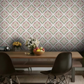 Dining room with patterned wallpaper, wooden table, and chairs.