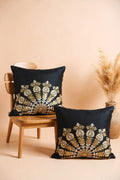 Decorative pillows with gold embroidery on a beige background