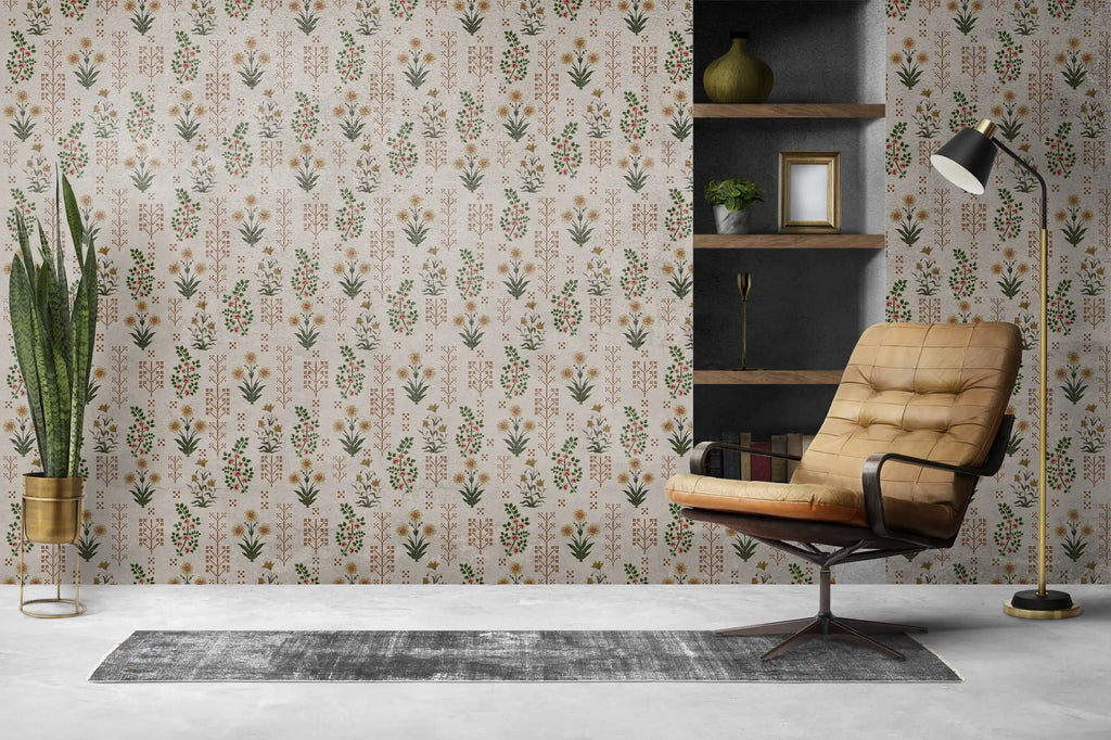 Room interior with a brown leather chair, bookshelf, and decorative plants against a floral wallpaper.