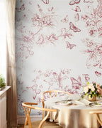Dining room with floral and butterfly wallpaper, wooden chair, and table setting.
