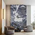 Modern living room with a decorative wall panel featuring blue leaf and butterfly pattern.