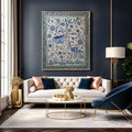 Living room with a white sofa, decorative pillows, a coffee table, and a large framed artwork on the wall.