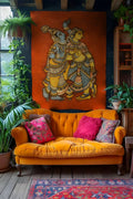 Orange sofa with colorful cushions in a room with a large wall tapestry and plants.