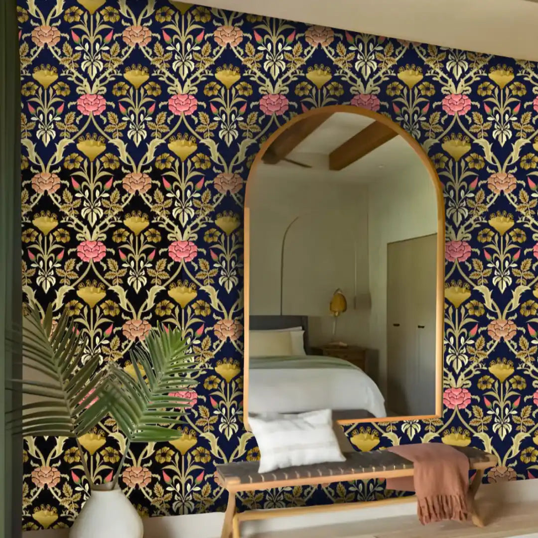 Decorative floral-patterned wall with a large mirror and bench in a bedroom setting.