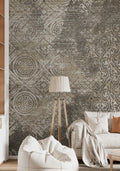 Living room with patterned wallpaper, bean bag chair, and lamp.