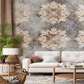 Living room with decorative wallpaper, white sofa, and wooden coffee table.