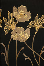 Gold floral embroidery on black fabric