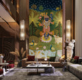 Luxurious living room with a large wall mural of a deity, surrounded by modern decor.