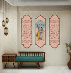 Decorative wall art with floral and classical design in a room with a bench and small table.