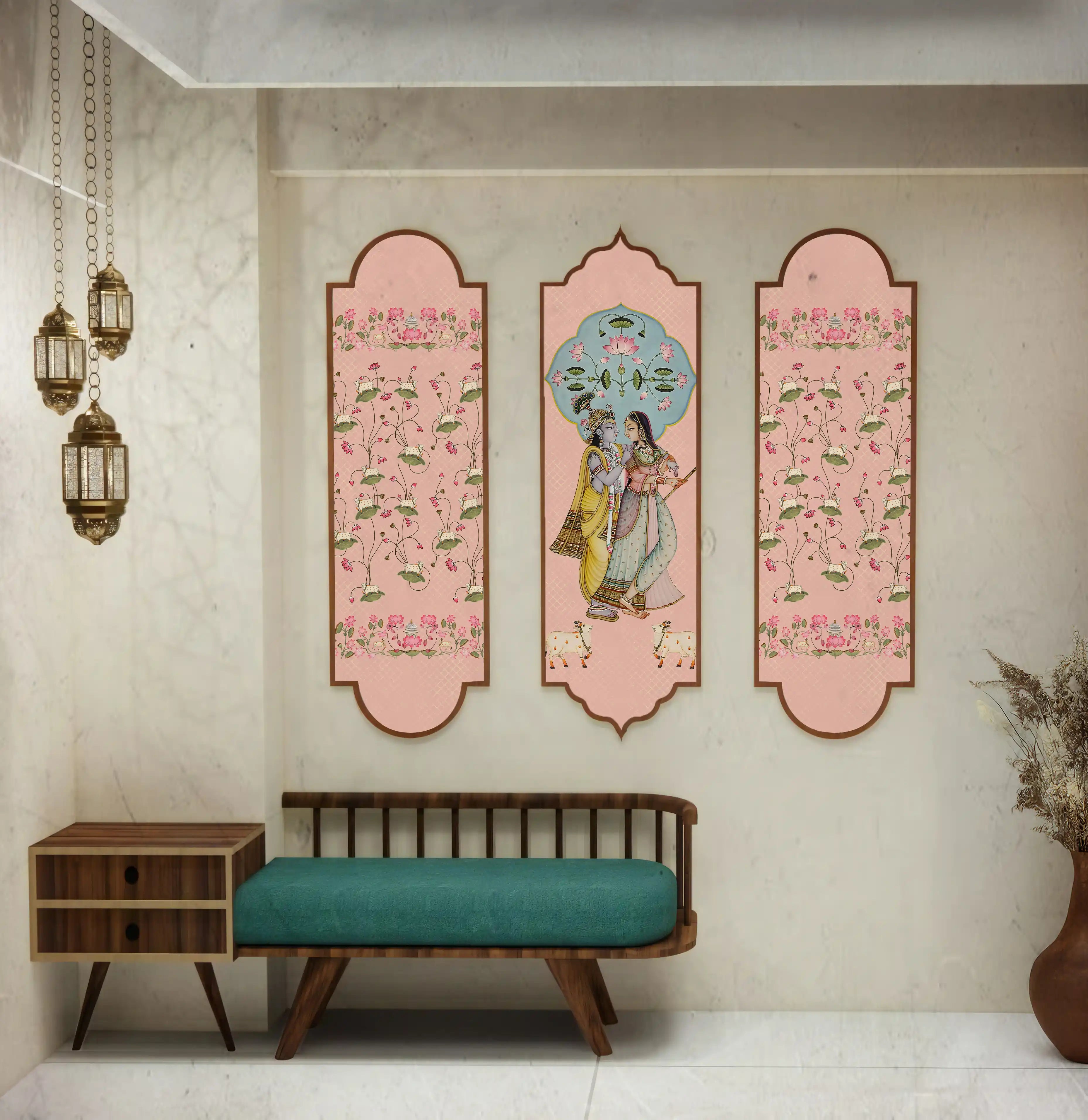 Decorative wall art with floral and classical design in a room with a bench and small table.