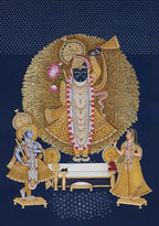 Decorative artwork of a deity with attendants on a blue background