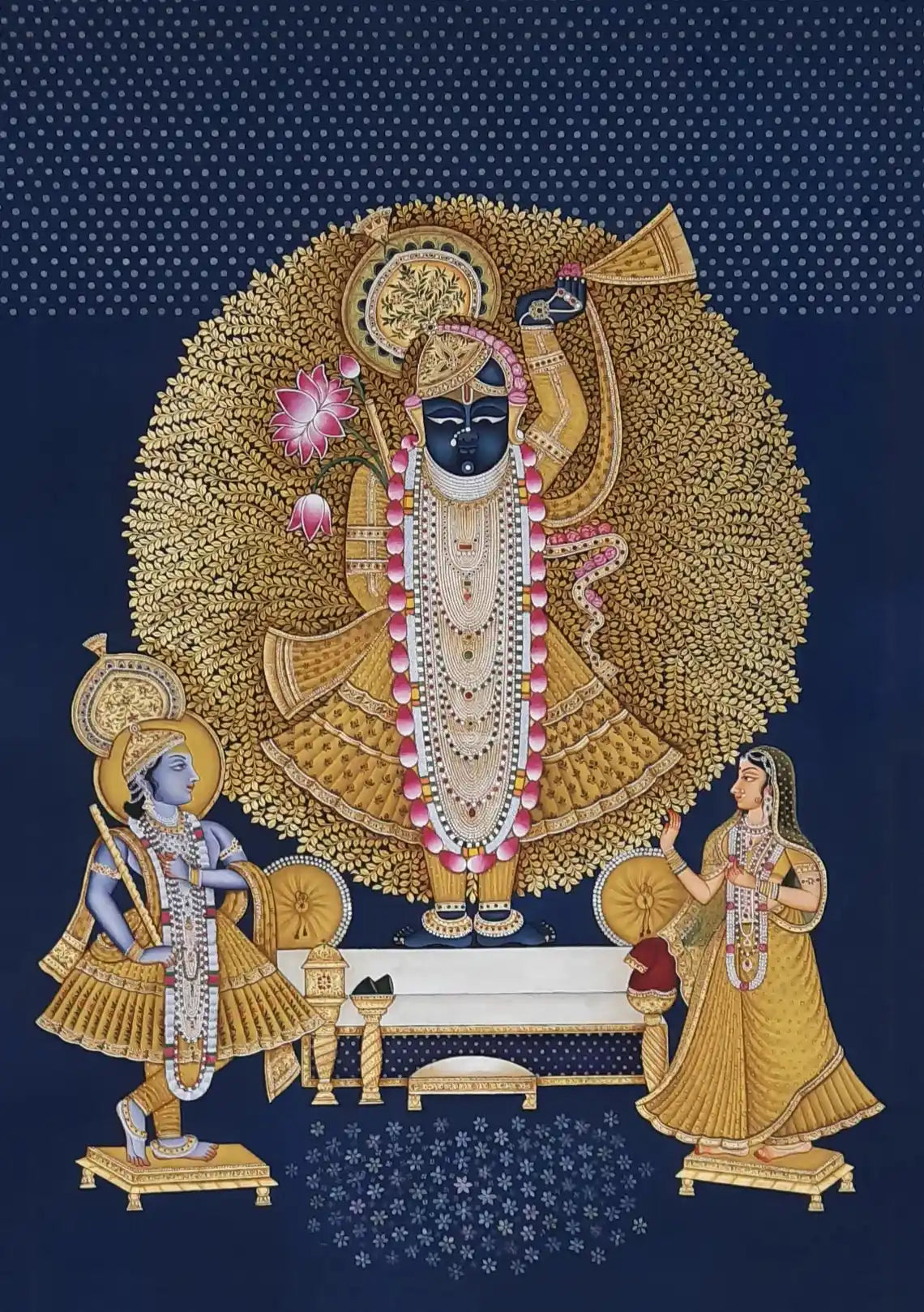 Decorative artwork of a deity with attendants on a blue background