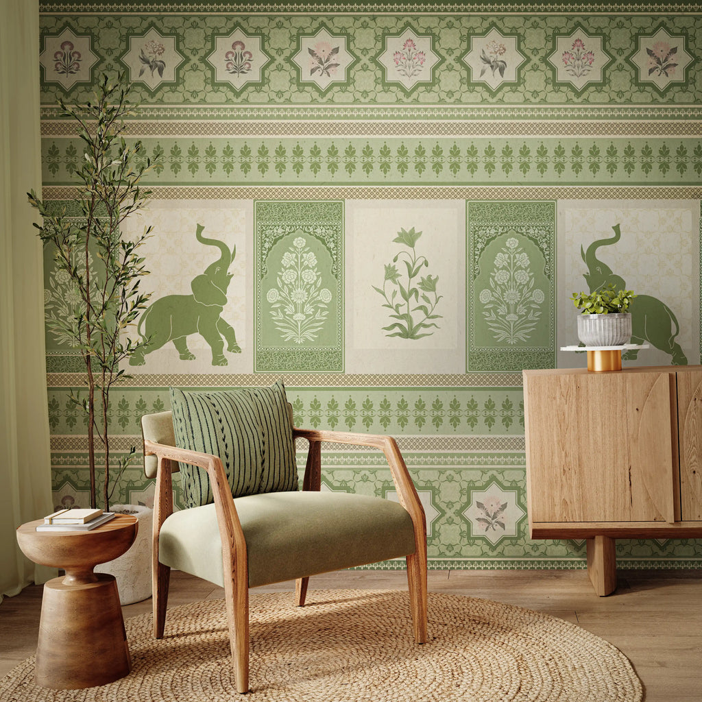 Living room with green patterned wallpaper, armchair, and wooden cabinet.