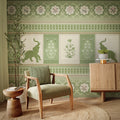Living room with green patterned wallpaper, armchair, and wooden cabinet.
