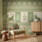 Living room with green patterned wallpaper, armchair, and wooden cabinet.