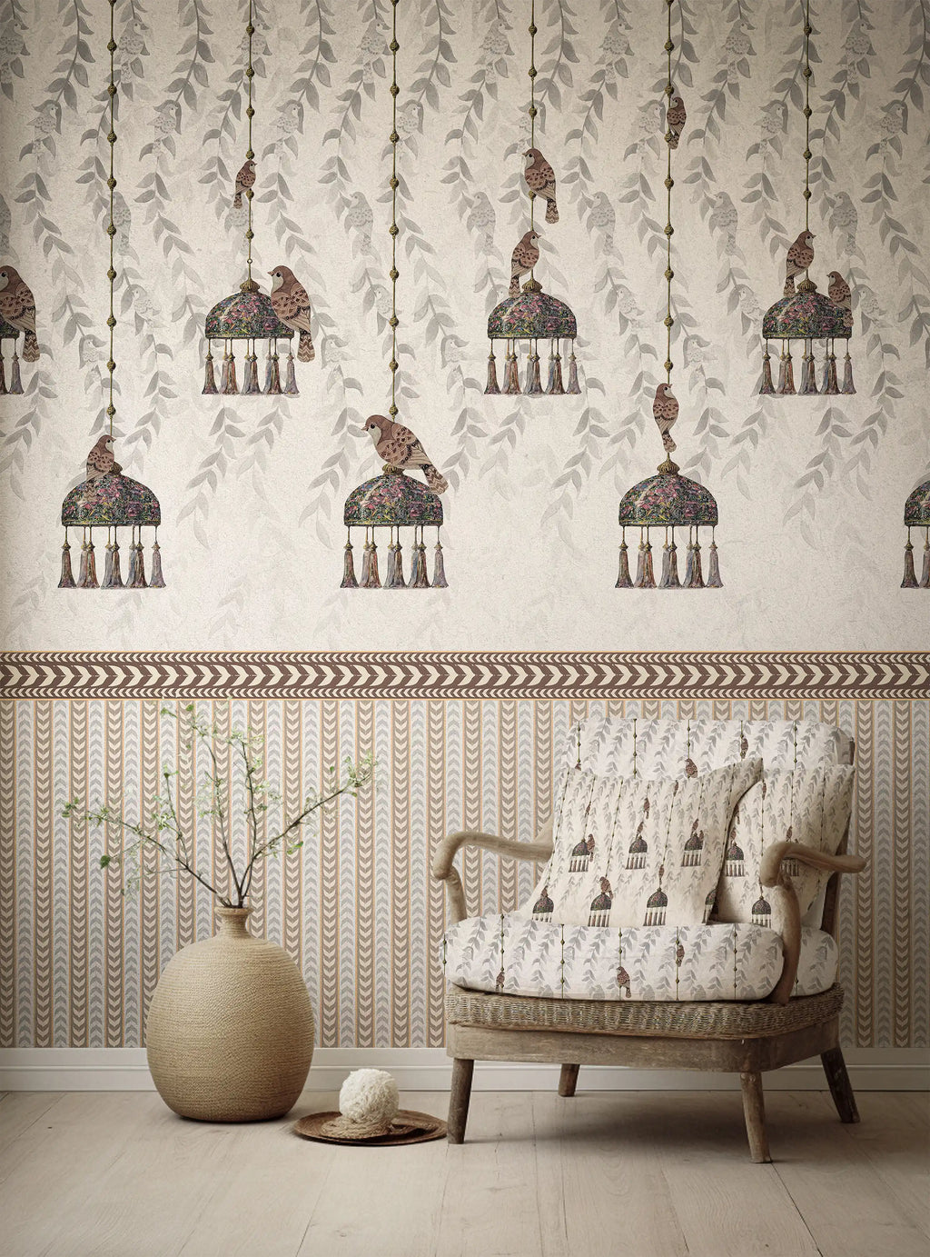 Patterned wallpaper with hanging bird design and a matching armchair in a room.