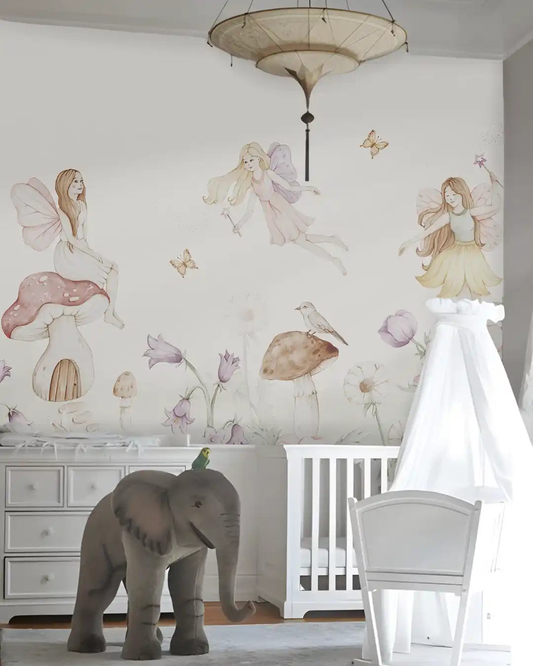 Children's room with tree wall decal, swing, and rocking horse.