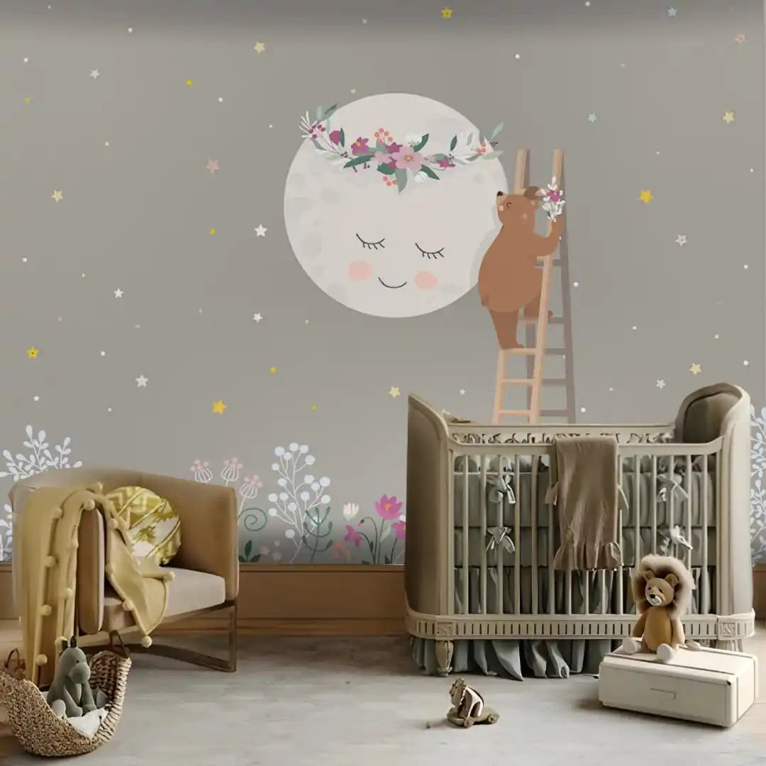 Nursery room with crib, chair, and decorative wall stickers on a gray wall.
