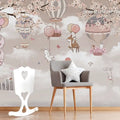 Children's room with decorative wallpaper featuring hot air balloons and animals, a chair with a star pillow, and a white rocking horse.
