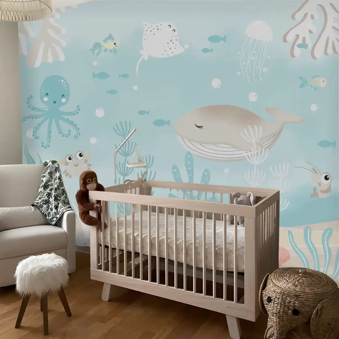 Nursery room with crib and ocean-themed wallpaper