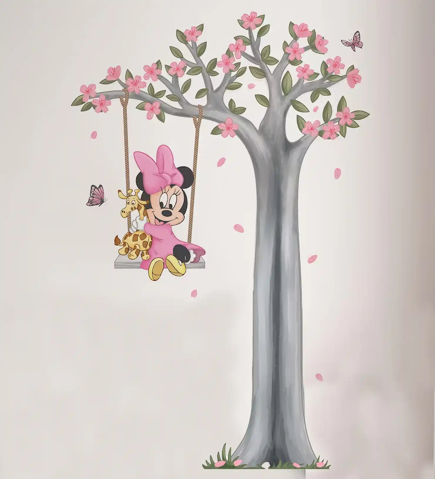 Wall decal of Minnie Mouse on a swing with a tree and butterflies.