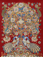 Decorative fabric with intricate peacock and floral pattern on a red background