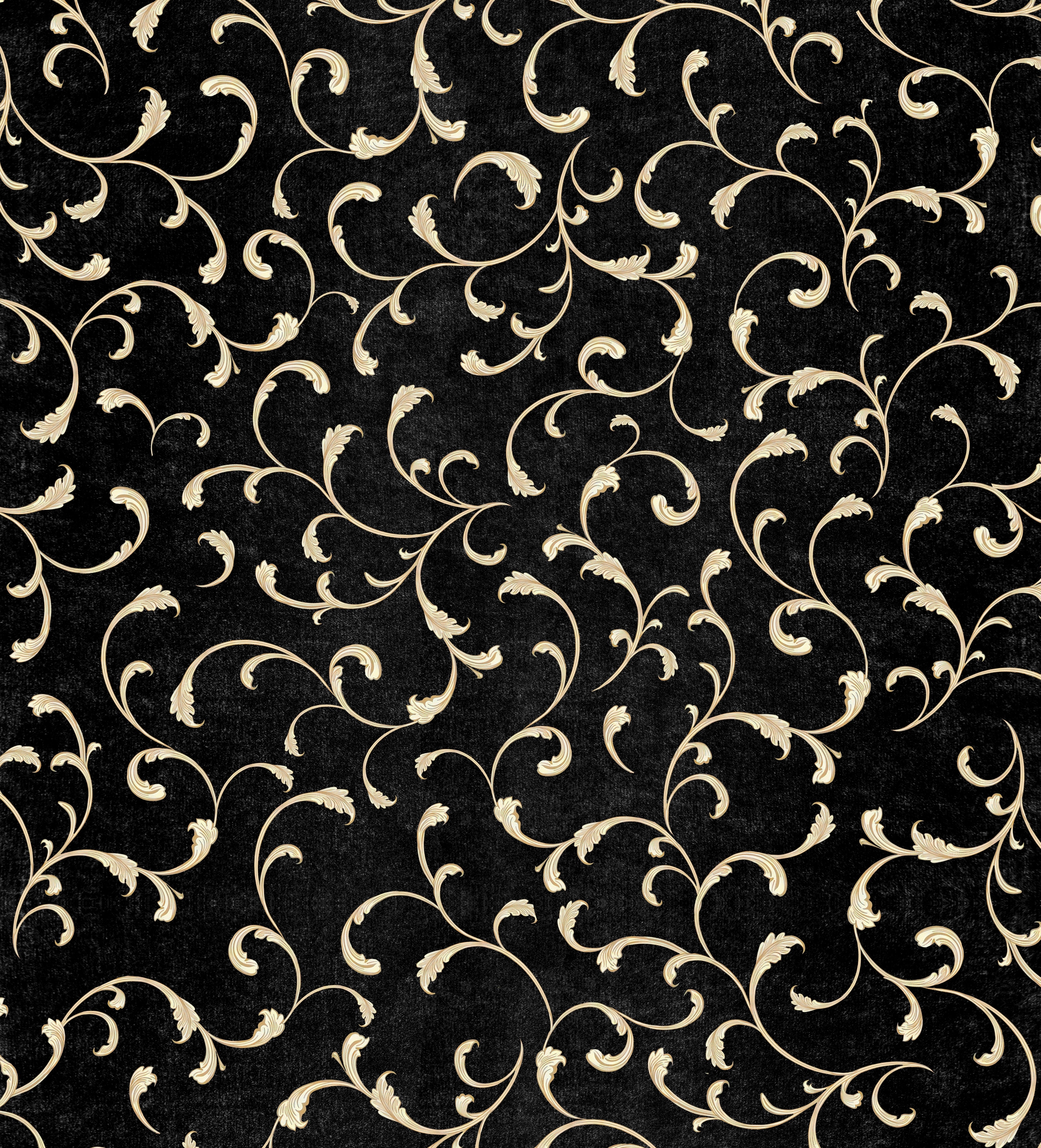 Decorative pattern of gold swirls on a black background