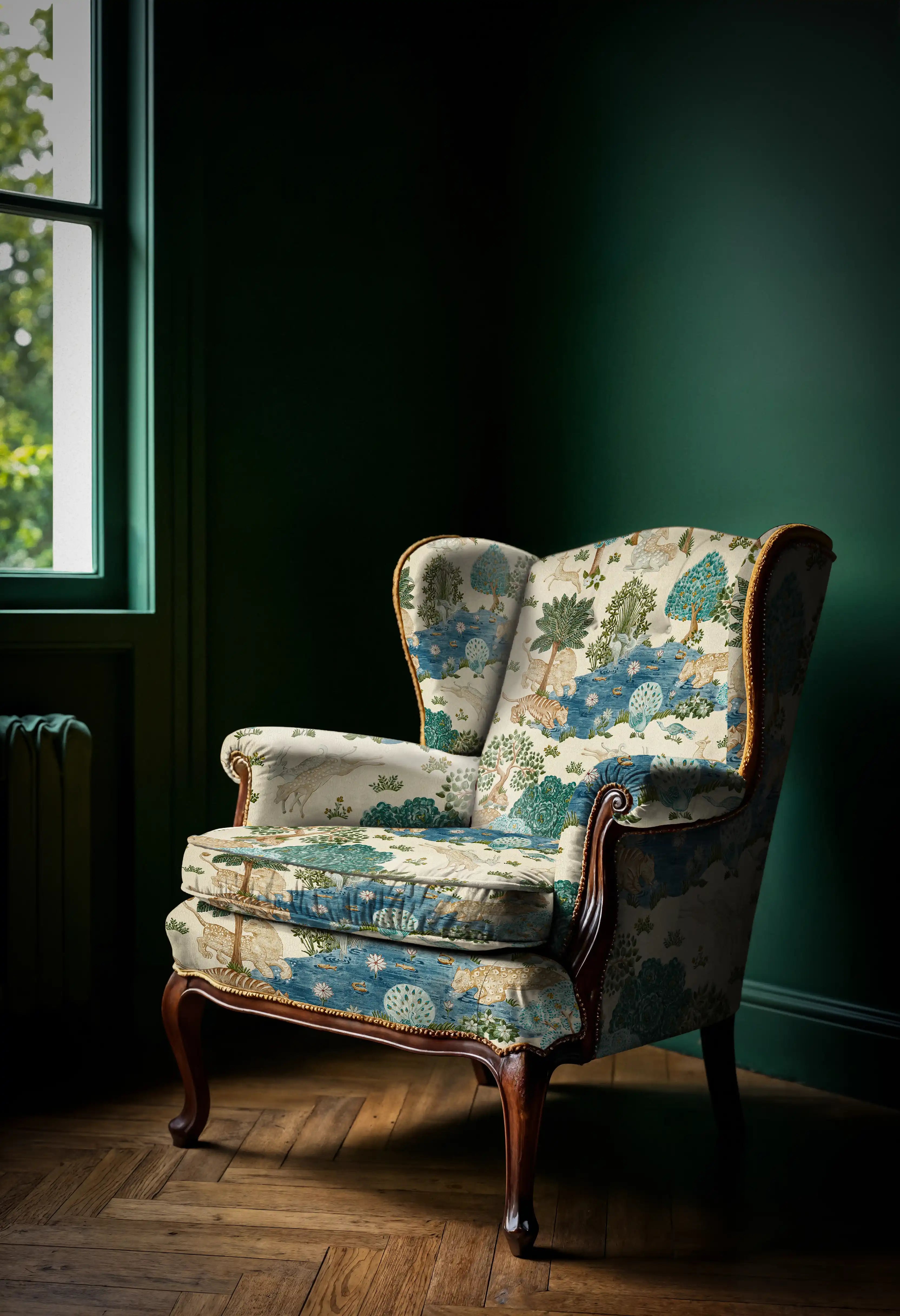 Vintage armchair with floral pattern in a room with dark green walls and wooden floor.