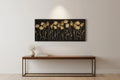Floral artwork on a wall above a wooden console table.